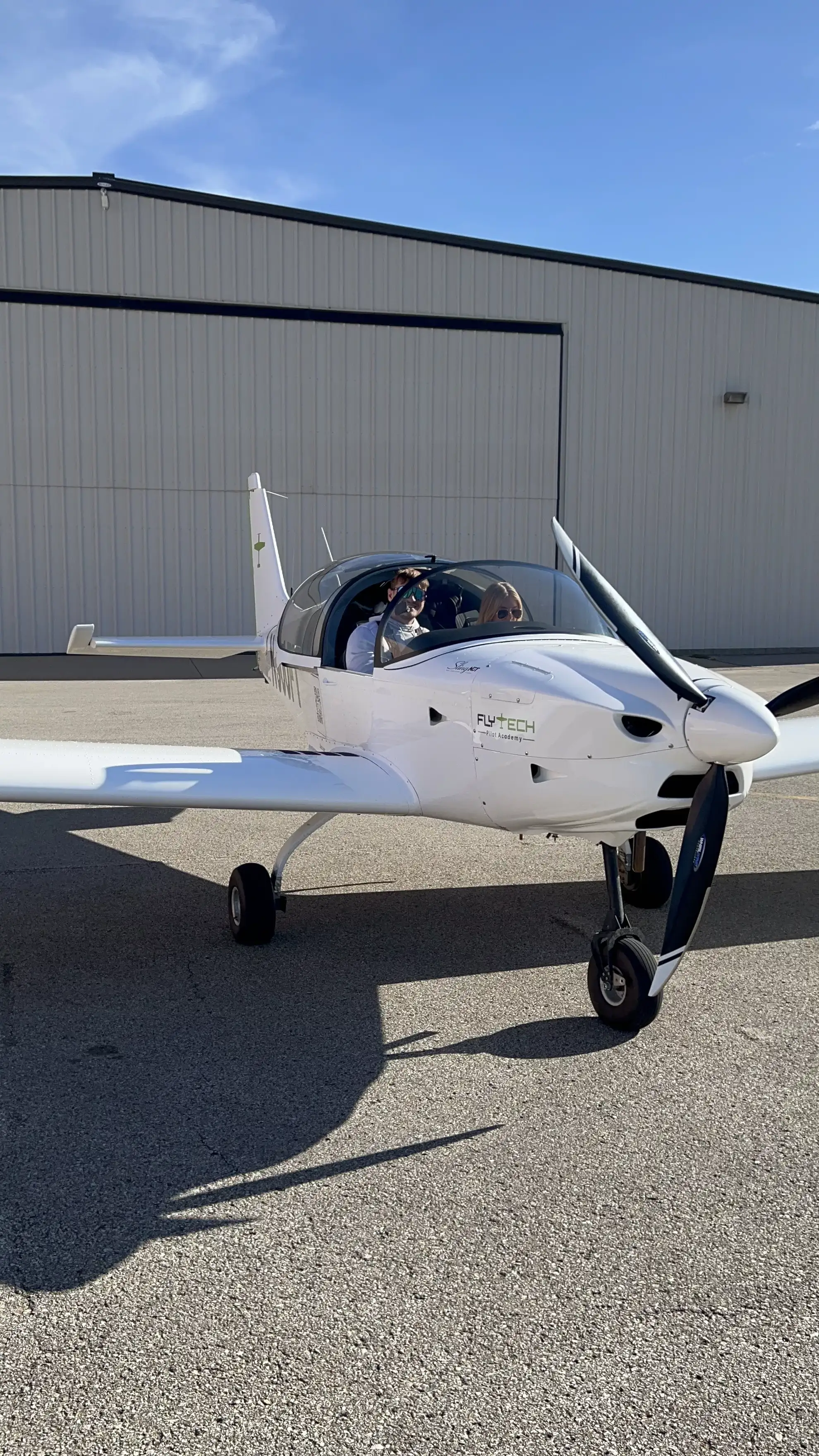 Pilot preparing for a flight during a FlyTech promotion event