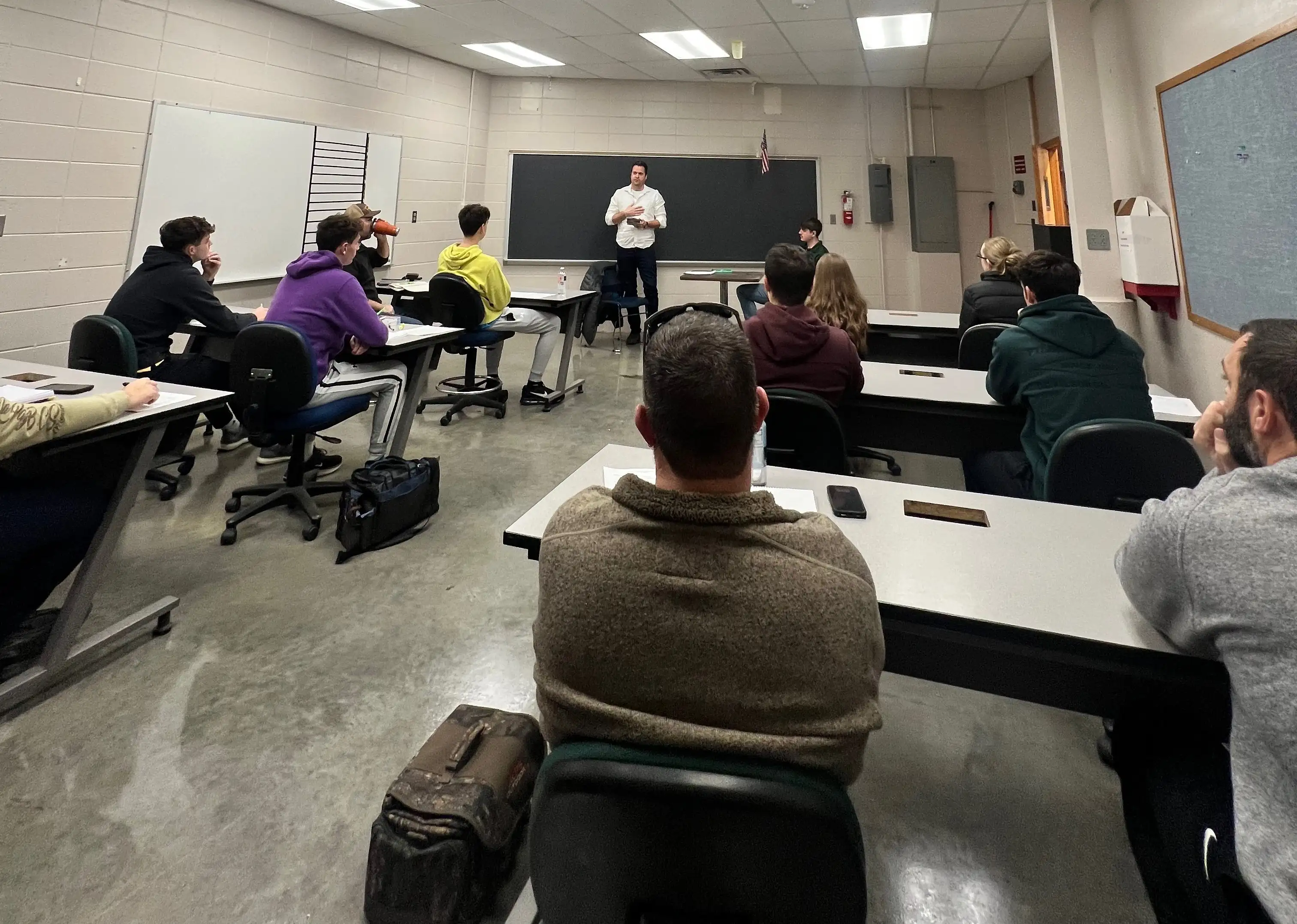 FlyTech Pilot Academy instructors and students standing in front of an airplane