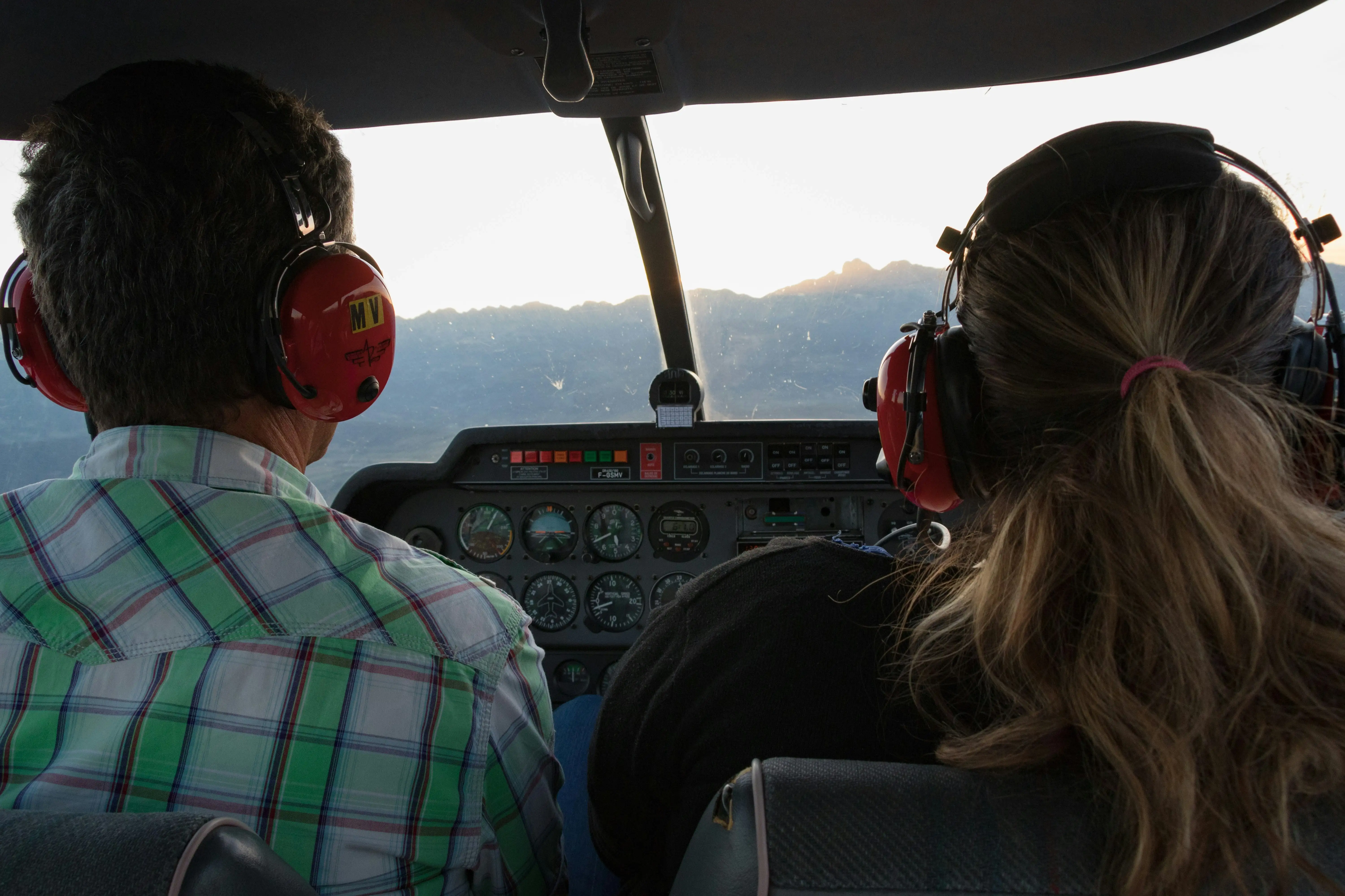 Photograph of a FlyTech Pilot Academy aircraft soaring over the Missouri landscape