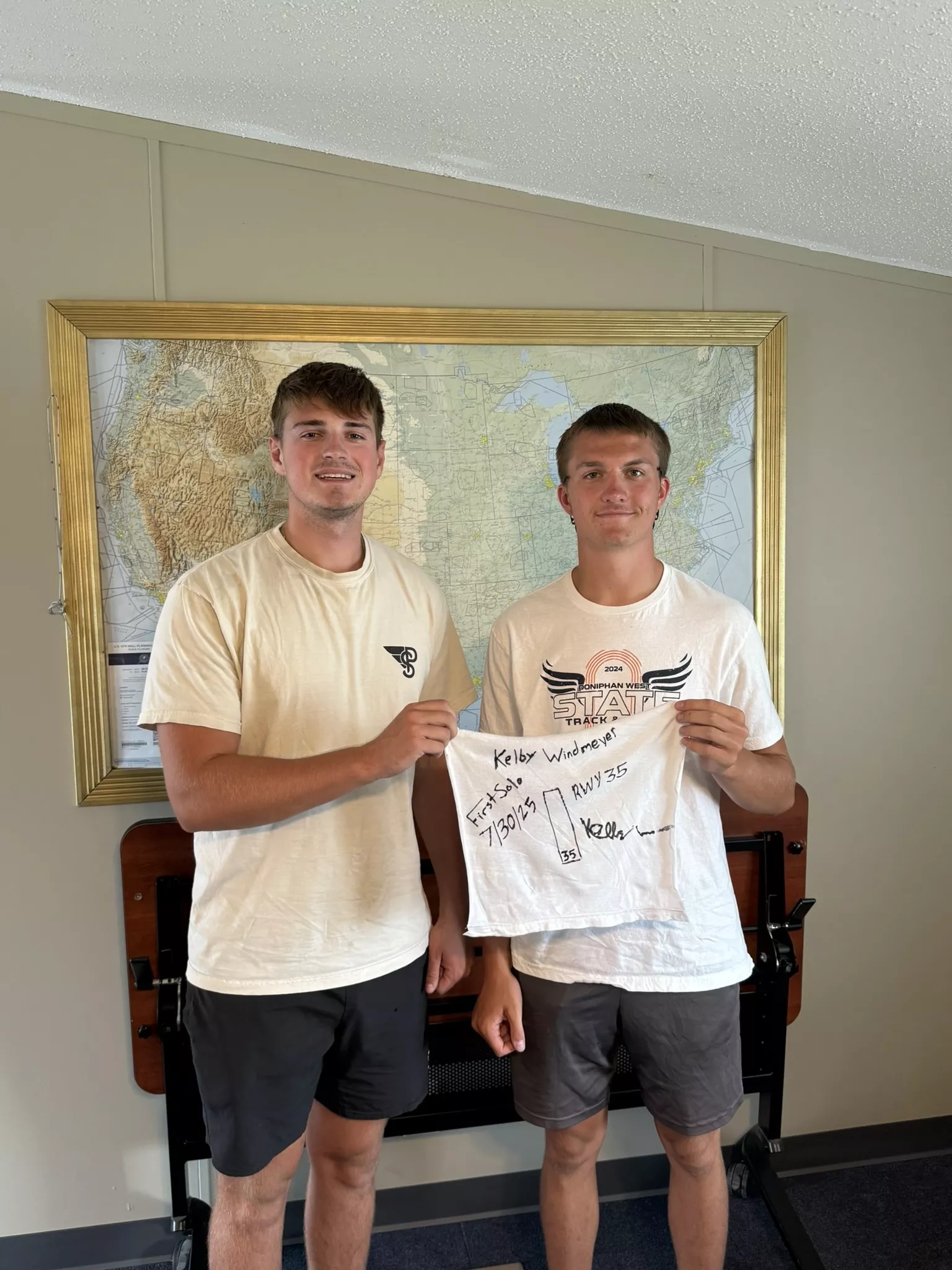 FlyTech Pilot Academy student smiling in front of an airplane