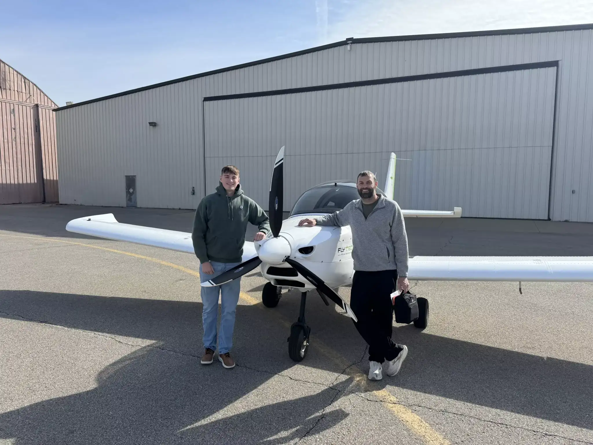 FlyTech Pilot Academy student and flight instructor in a Cessna airplane cockpit